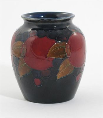 Appraisal: Pomegranate' a Moorcroft Pottery vase painted in colours on a