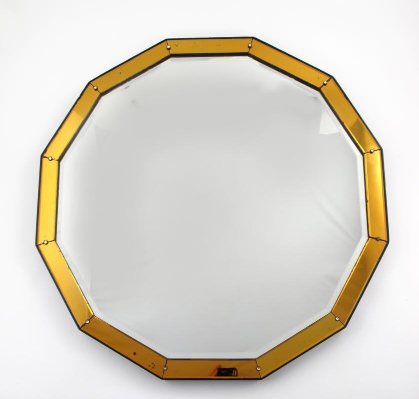 Appraisal: A peach tinted mirrored glass wall mirror