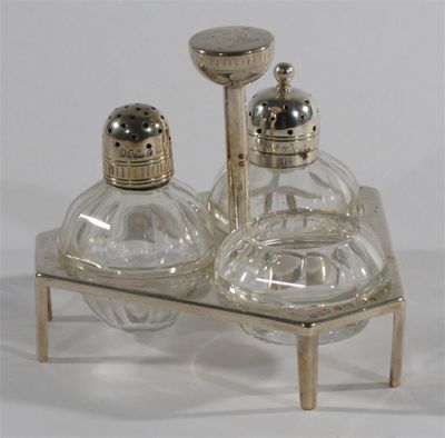 Appraisal: A Hukin Heath electroplated cruet with glass holders designed by