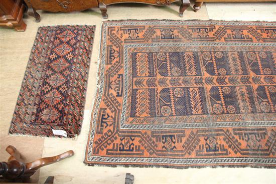 Appraisal: TWO ORIENTAL RUGS An area rug with burnt orange ground