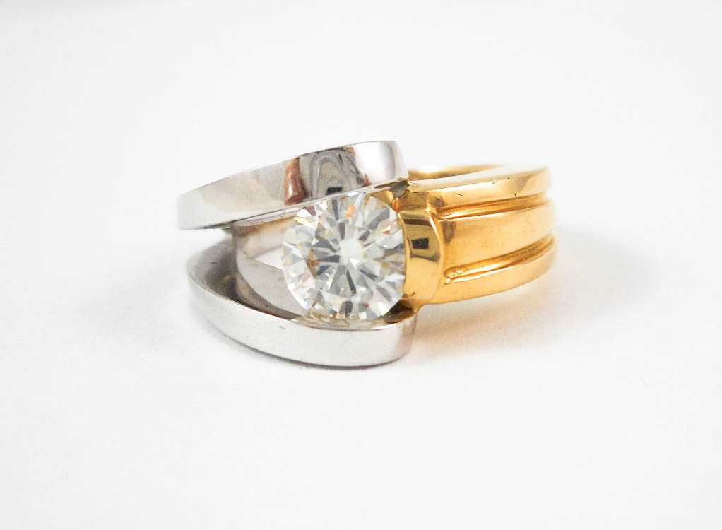 Appraisal: MOISSANITE AND FOURTEEN KARAT GOLD RING The yellow and white