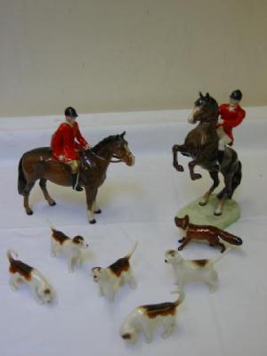 Appraisal: A BESWICK HUNT comprising huntsman on a rearing bay horse