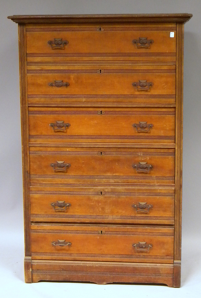 Appraisal: Late Victorian Birch Six-Drawer Tall Chest with owl mask drawer