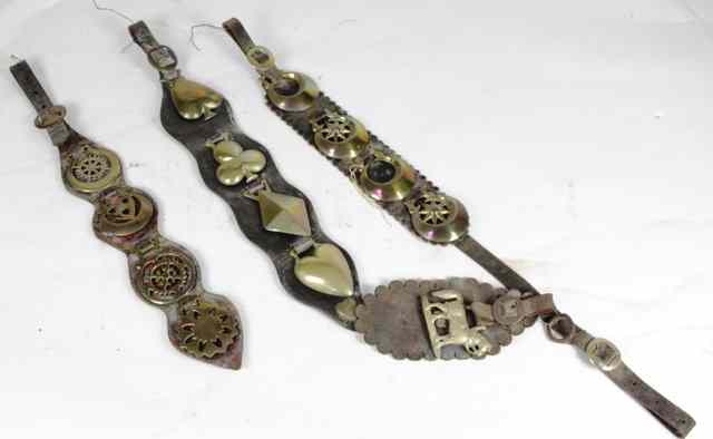 Appraisal: Three straps each set with four horse brasses