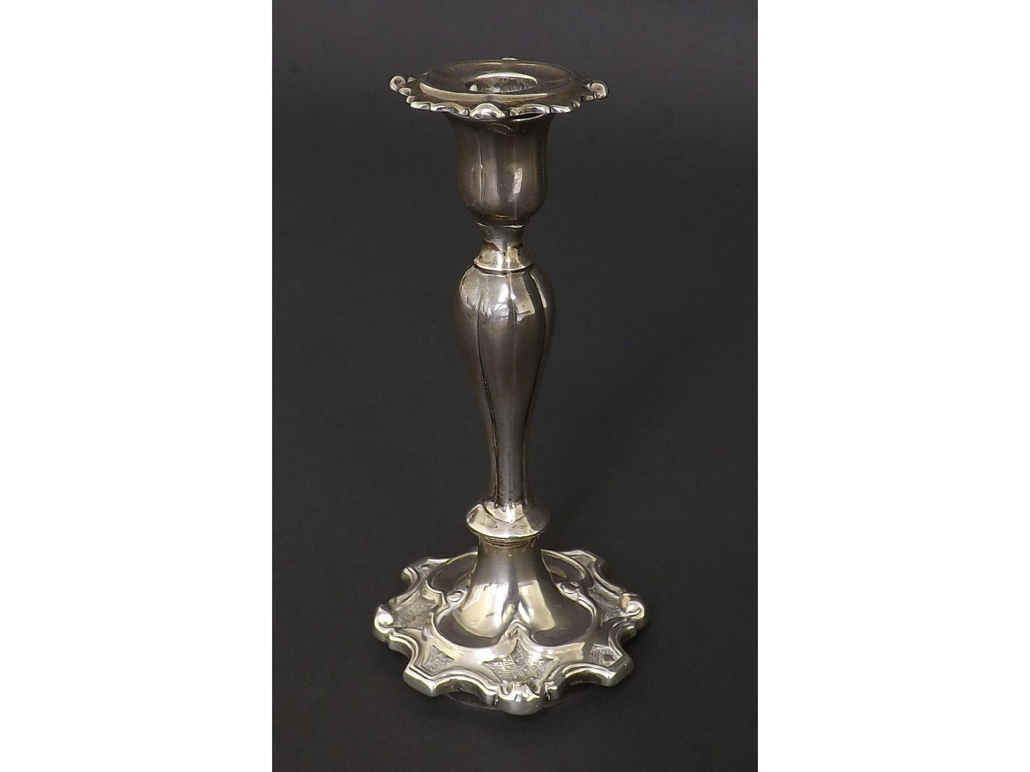 Appraisal: Victorian silver taper stick with fluted baluster column and ecclesiastical