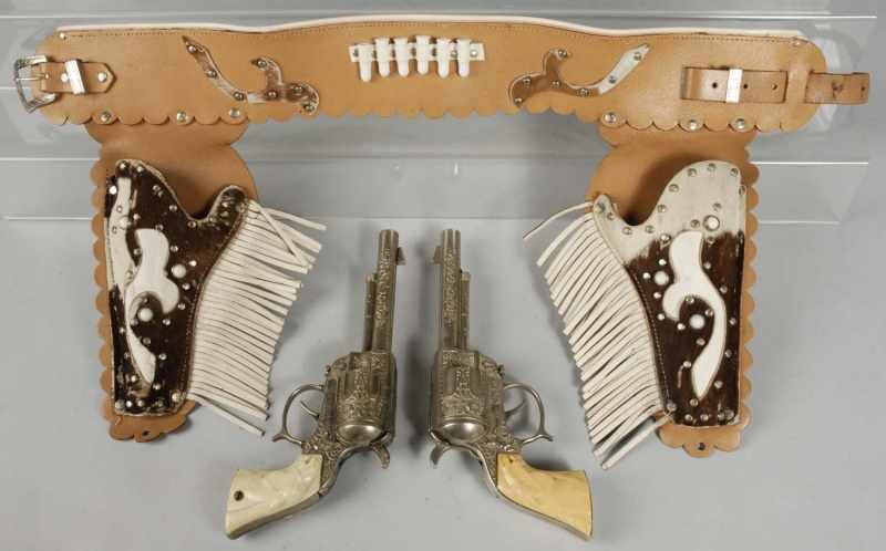 Appraisal: Wild Bill Hickok Gun Holster Set Description Pop tops work