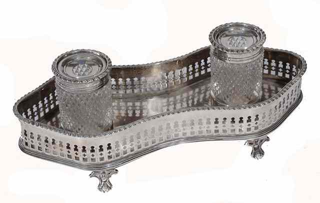 Appraisal: A VICTORIAN SILVER DESK STAND with pierced gallery and fitted