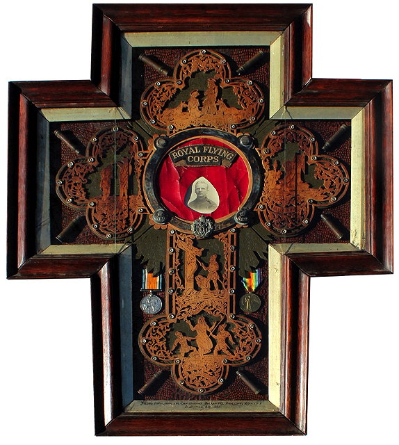 Appraisal: A FRAMED MONTAGE IN THE FORM OF A CROSS RELATING