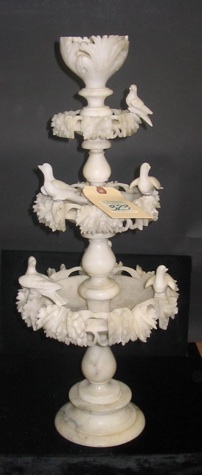 Appraisal: AN ALABASTER CARVED TABLE DECORATION having tiers for floating flowers