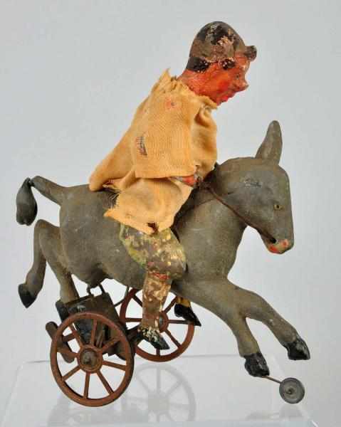 Appraisal: Tin Litho Gunthermann Clown Riding Donkey Toy Description German Original