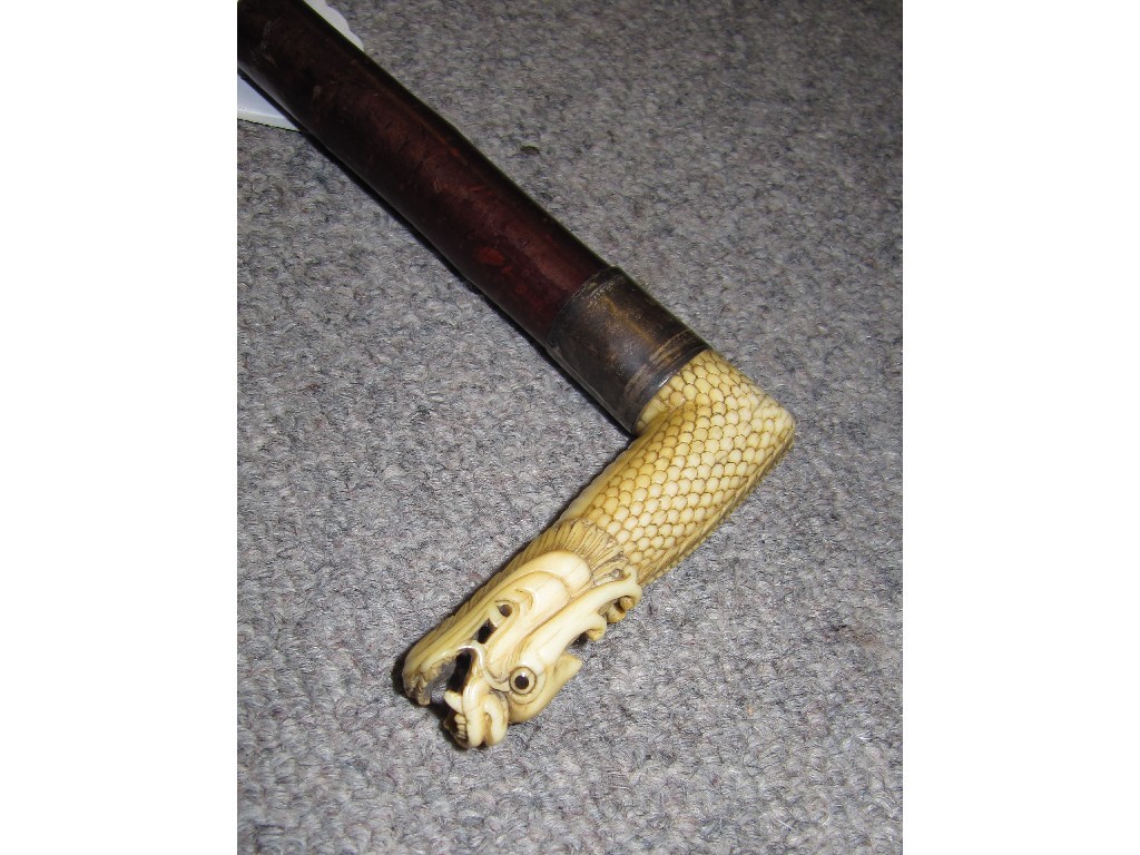 Appraisal: Parasol with carved ivory dragon handle