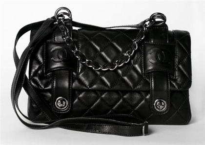 Appraisal: Chanel black quilted kidskin purse Flap-front with two turn-lock closure