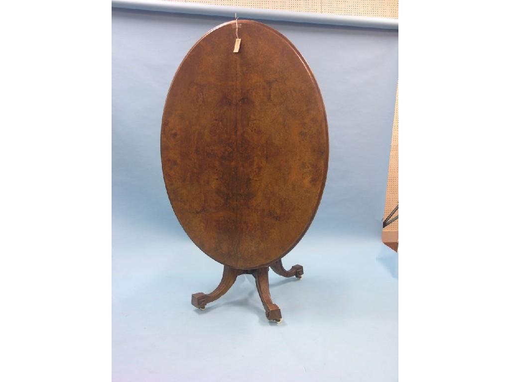 Appraisal: A Victorian walnut tilt-top breakfast table oval quarter-veneered top on