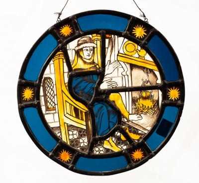 Appraisal: A medieval style circular stained glass panel depicting a figure