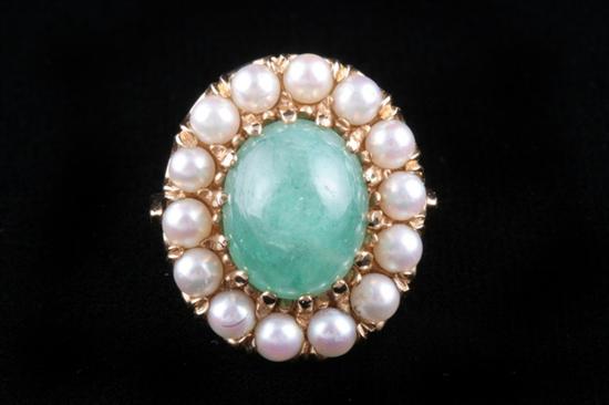 Appraisal: K YELLOW GOLD EMERALD AND SEED PEARL RING Oval emerald