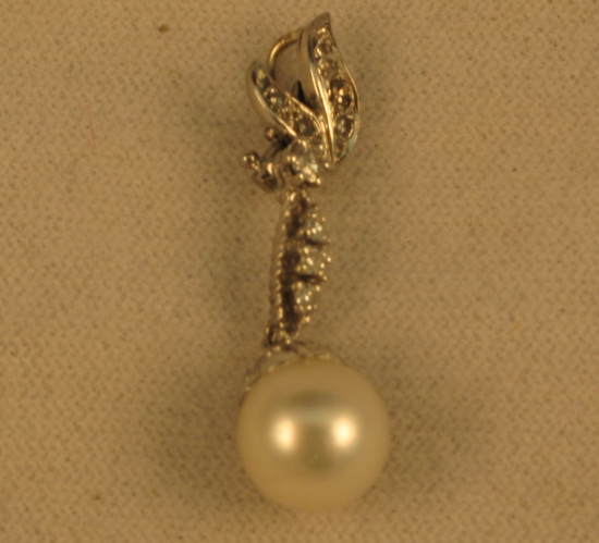 Appraisal: PEARL DIAMOND AND FOURTEEN KARAT WHITE GOLD PENDANT set with