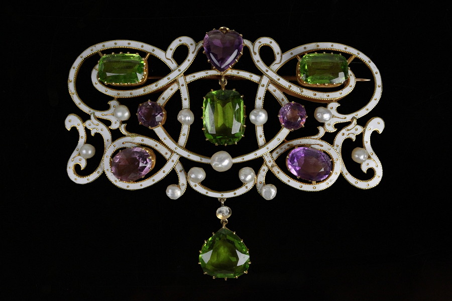 Appraisal: An amethyst peridot pearl and enamel brooch pendant possibly of