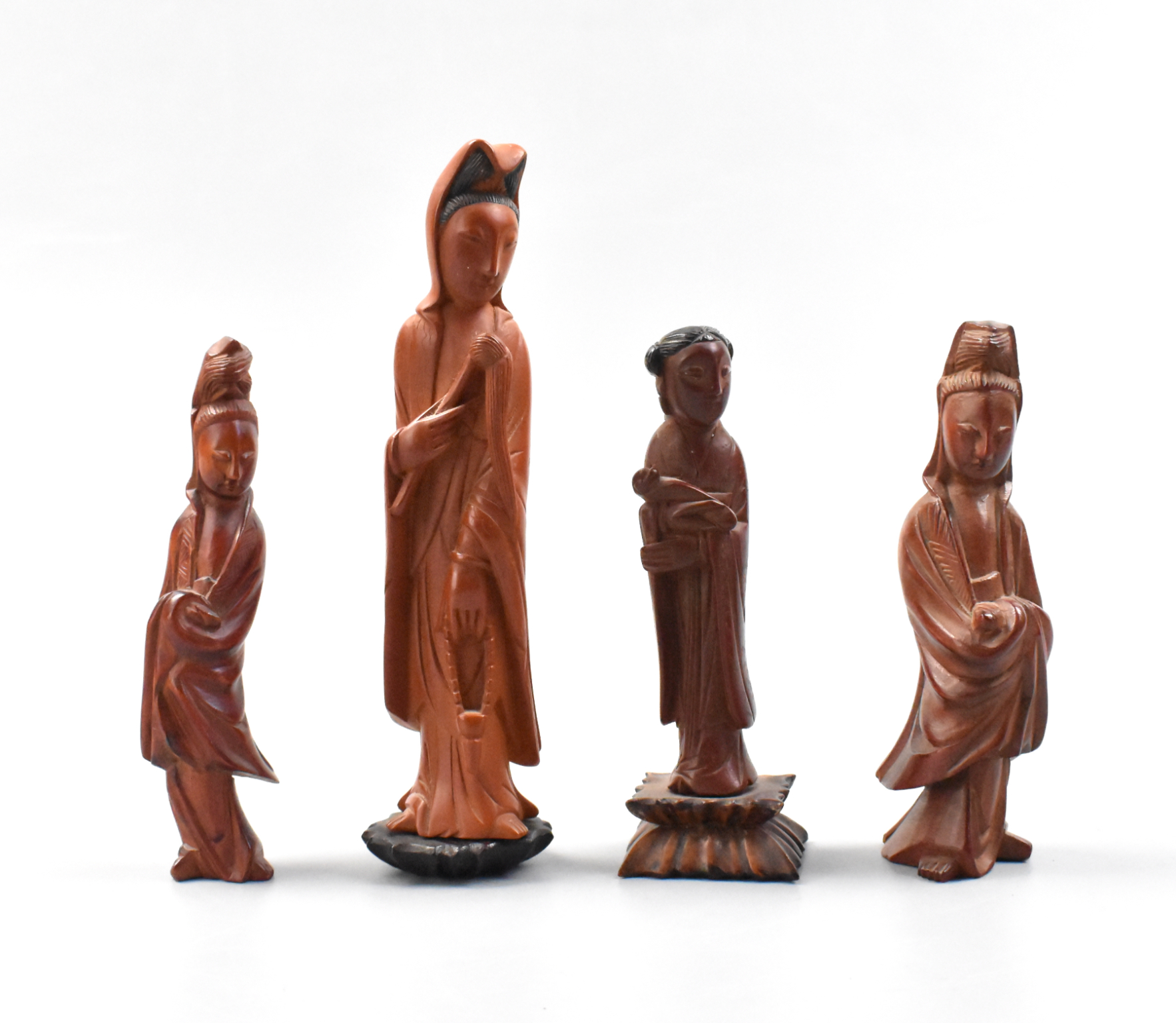 Appraisal: Four Chinese wood carved figures of different sizes and a