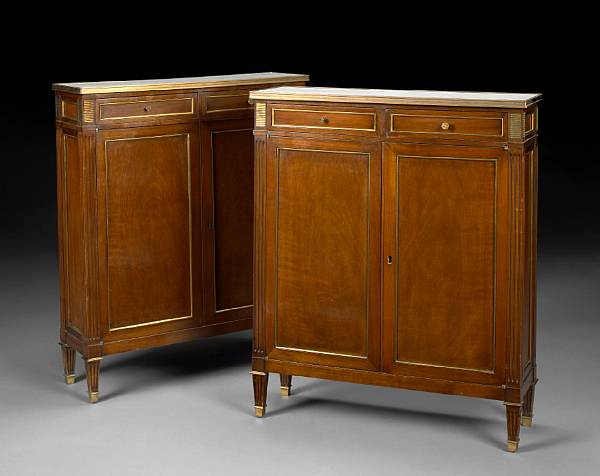 Appraisal: A pair of Louis XVI style mahogany cabinets th century