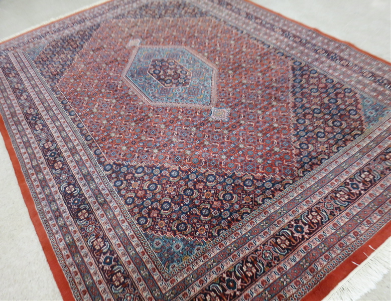 Appraisal: HAND KNOTTED ORIENTAL CARPET Indo-Bijar concentric hexagonal medallion design with