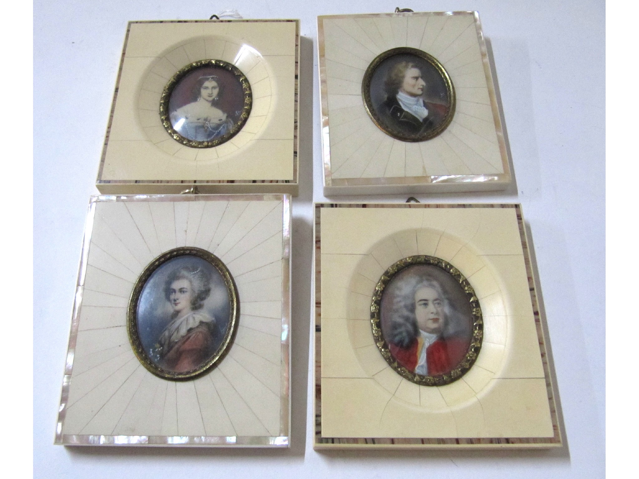 Appraisal: A lot comprising four portrait miniatures in ivorine frames