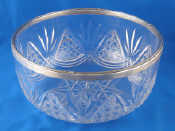 Appraisal: A cut glass salad bowl with silver ribbon and reed