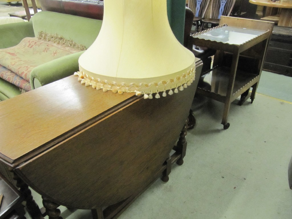 Appraisal: Oak gateleg table tea trolley firescreen and floor lamp with