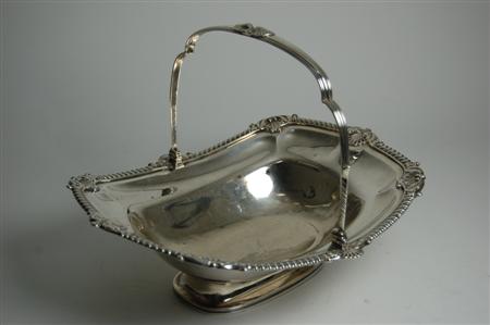 Appraisal: A George III cake basket London gadroon and shell clasped