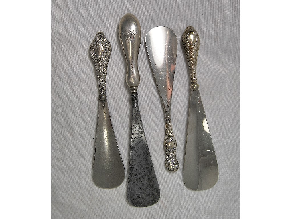 Appraisal: Set of four silver handled steel shoelifts