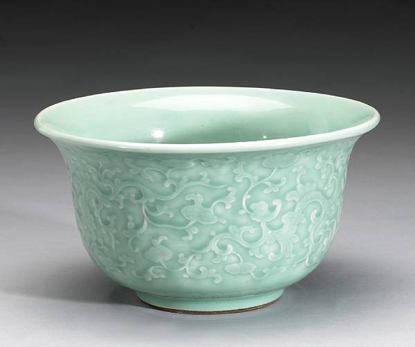 Appraisal: A celadon glazed porcelain footed bowl with molded decoration Qianlong