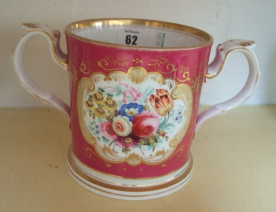 Appraisal: A Victorian painted porcelain two handled mug decorated with a