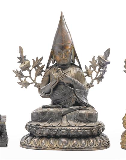 Appraisal: Tibetan copper Lama figure th century Seated on a double