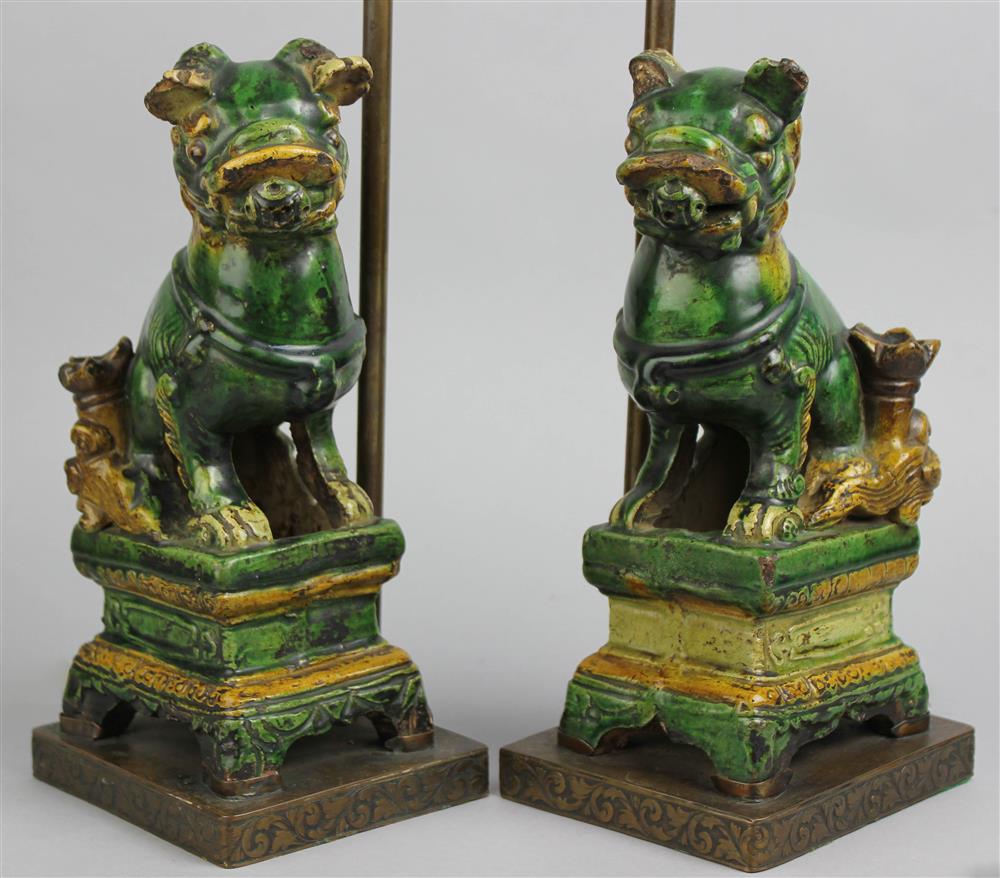 Appraisal: PAIR OF CHINESE SANCAI BUDDHISTIC LIONS NOW MOUNTED AS TABLE