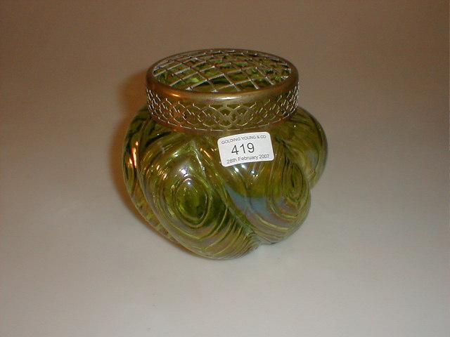 Appraisal: A Loetz style lobed green glass rose bowl with brass