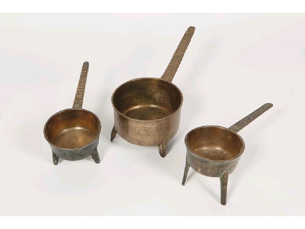 Appraisal: THREE BRONZE SKILLETS each with cast names to the handles