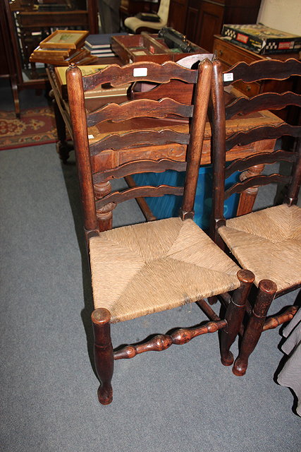 Appraisal: TWO SIMILAR ANTIQUE NORTH COUNTRY ASH AND ELM LADDERBACK DINING