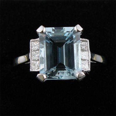 Appraisal: An aquamarine and diamond ring the step cut aquamarine with