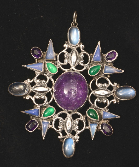 Appraisal: An Arts Crafts Suffragette pendant inset moonstones peridots and amethysts