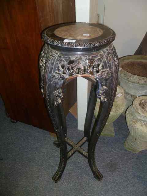 Appraisal: A CHINESE HARDWOOD TALL URN STAND with carved border high