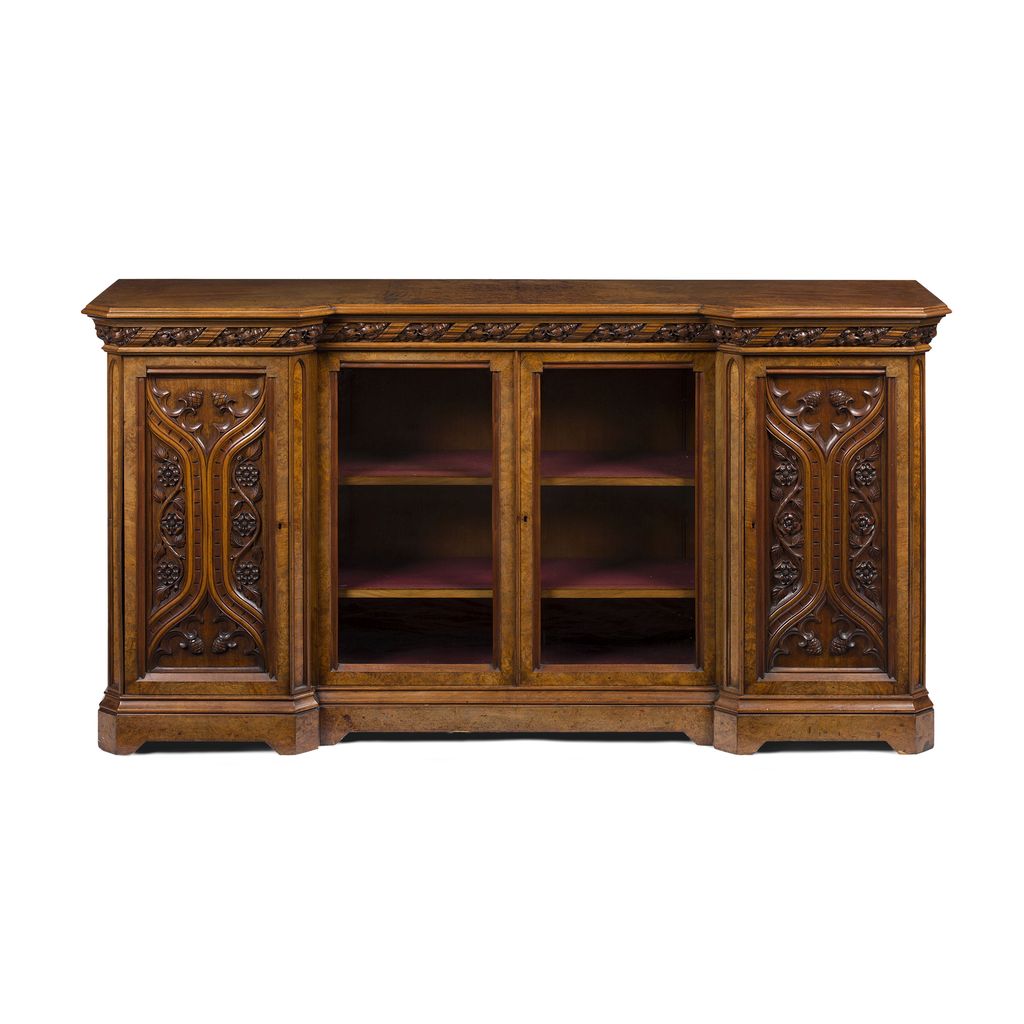 Appraisal: GOTHIC REVIVAL WALNUT CREDENZA TH CENTURY the moulded inverted breakfront