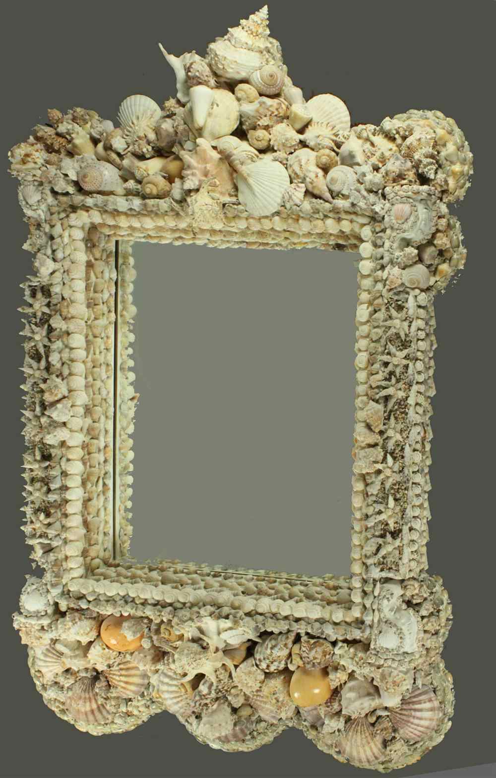 Appraisal: MONUMENTAL NATURAL SHELL ENCRUSTED WALL MIRROR WITH ELABORATE CREST having