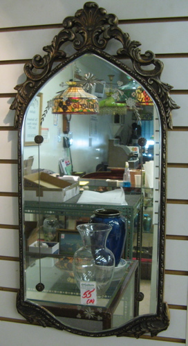 Appraisal: TWO ENGRAVED AND BEVELED SHAPED WALL MIRRORS from the 's