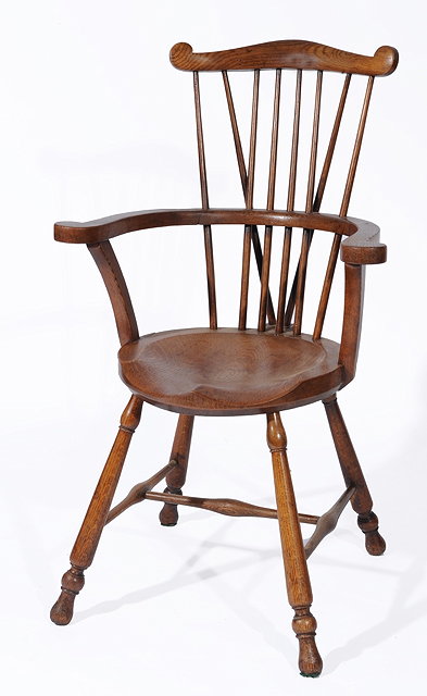 Appraisal: AN EARLY TH CENTURY OAK WINDSOR CHAIR with comb back