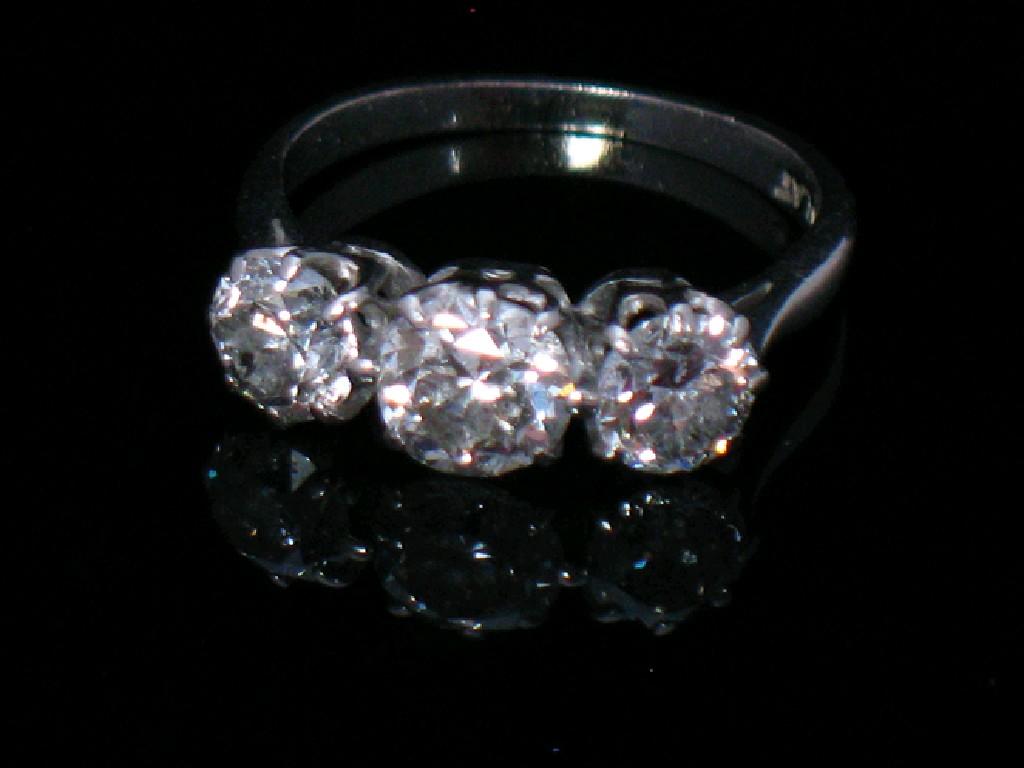 Appraisal: A THREE STONE DIAMOND DRESS RING the three graduated old-cut