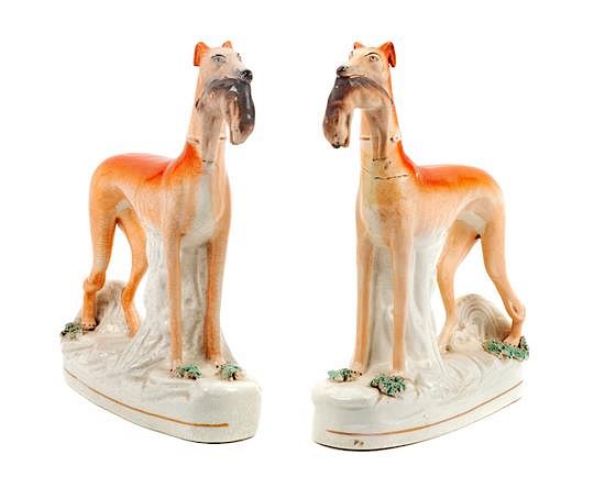 Appraisal: A Pair of Staffordshire Models of Greyhounds Height inches A