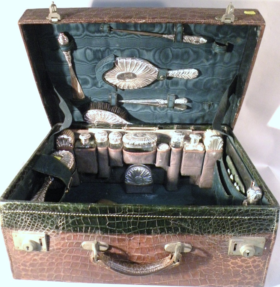 Appraisal: An Edwardian silver travelling dressing table and toilet set comprising