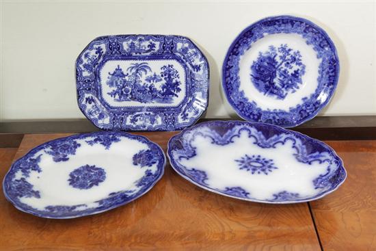 Appraisal: FOUR PIECES OF FLOW BLUE Including one flow blue platter