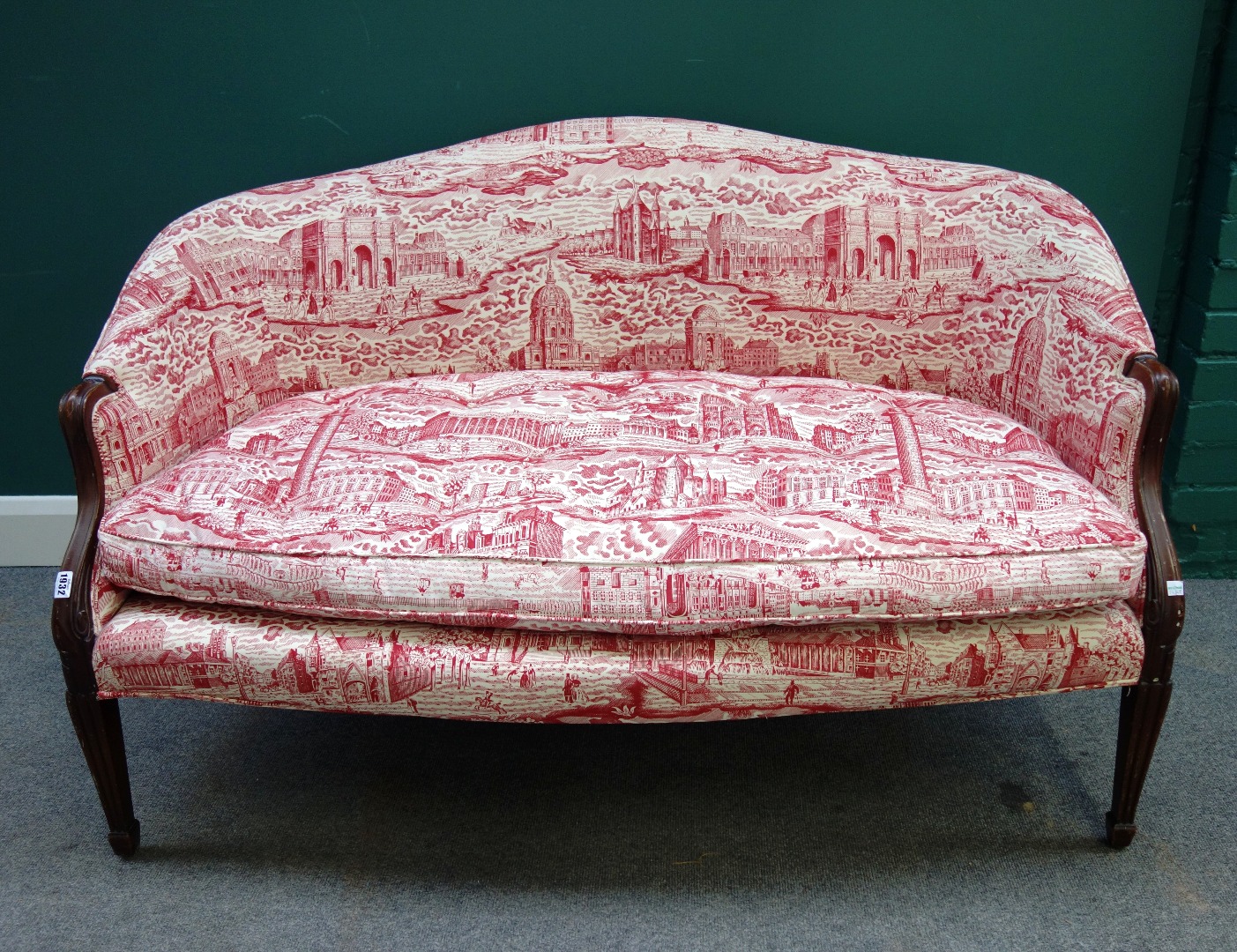 Appraisal: A small th century style tub back sofa on tapering