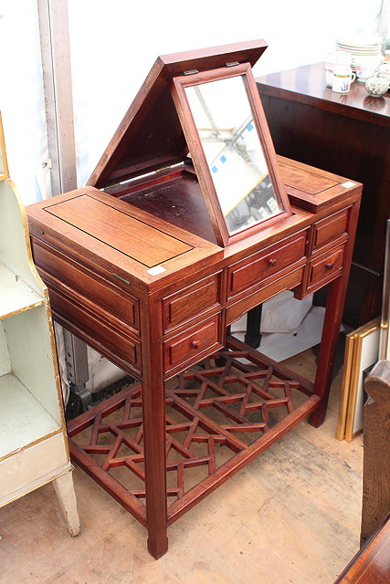 Appraisal: A CHINESE HARDWOOD DRESSING TABLE with central lift up mirror