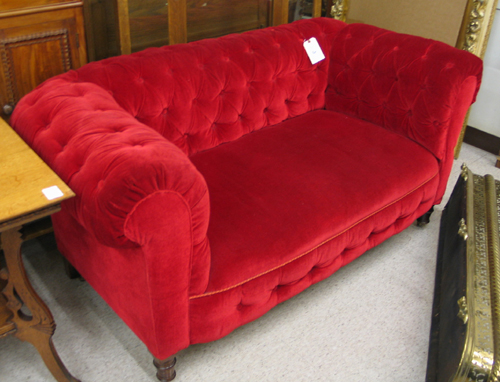 Appraisal: RED VELVET CHESTERFIELD SOFA English c The heavily upholstered sofa